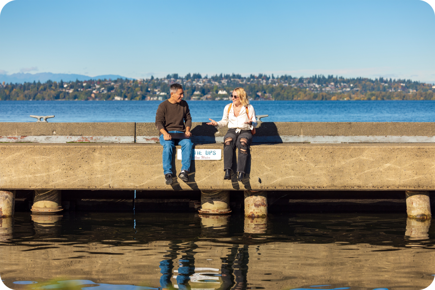 Water, Waterfront, Pier, Pants, Shoe, Port, Person, Glasses, Necklace, Jeans