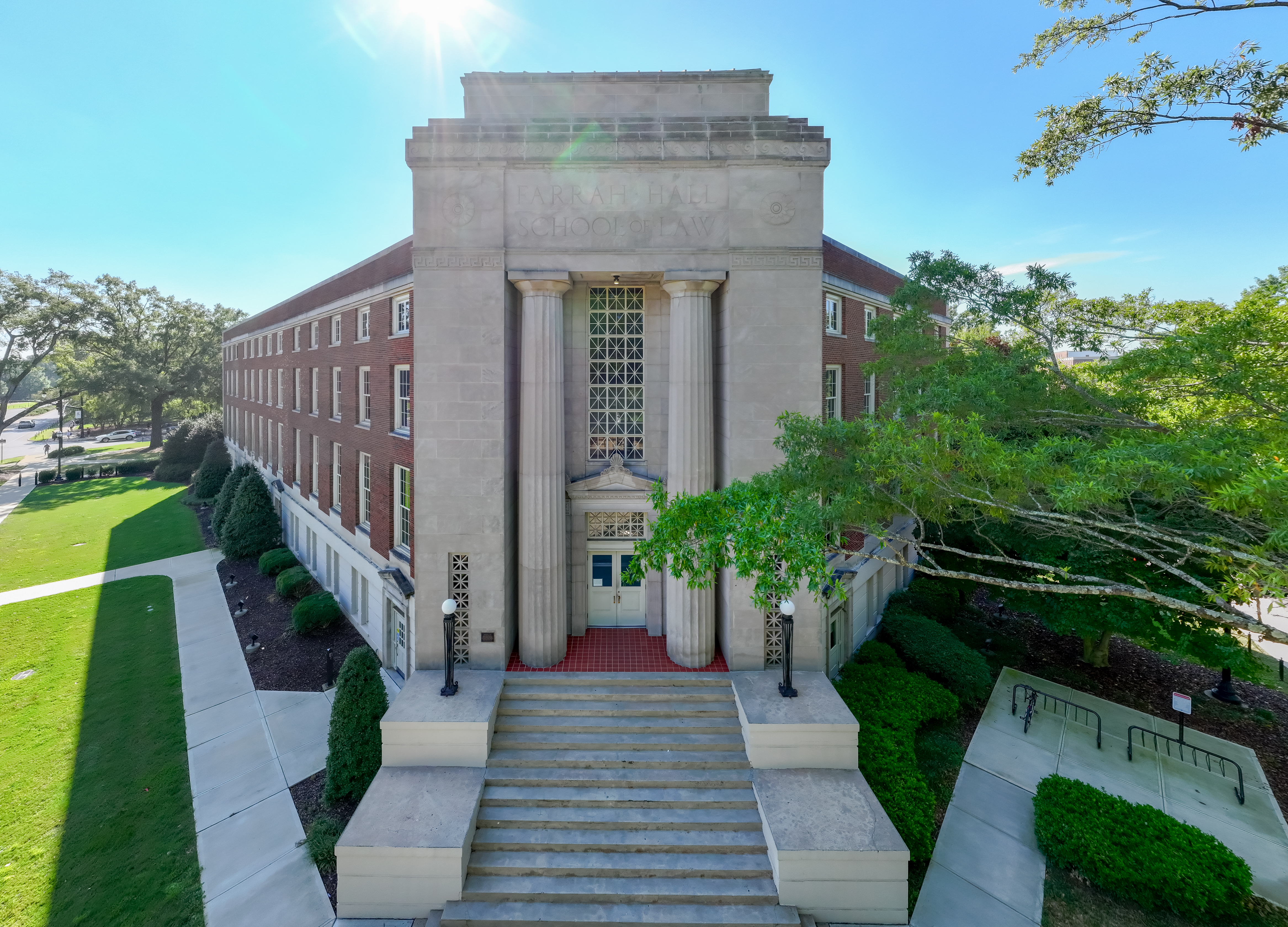 Grass, Plant, Building, Campus, Office Building, Lawn, Car, Vehicle, Person, Outdoors