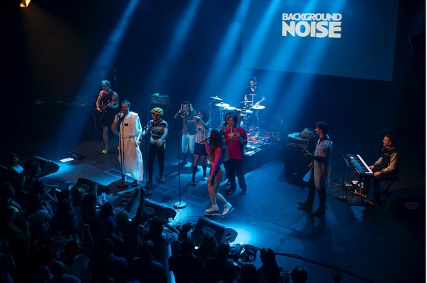Concert, Crowd, Person, Urban, Stage, Group Performance, Music Band, Lighting, Helmet, Guitar