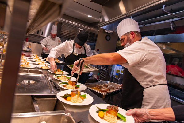 Dining employees preparing dinners to serve