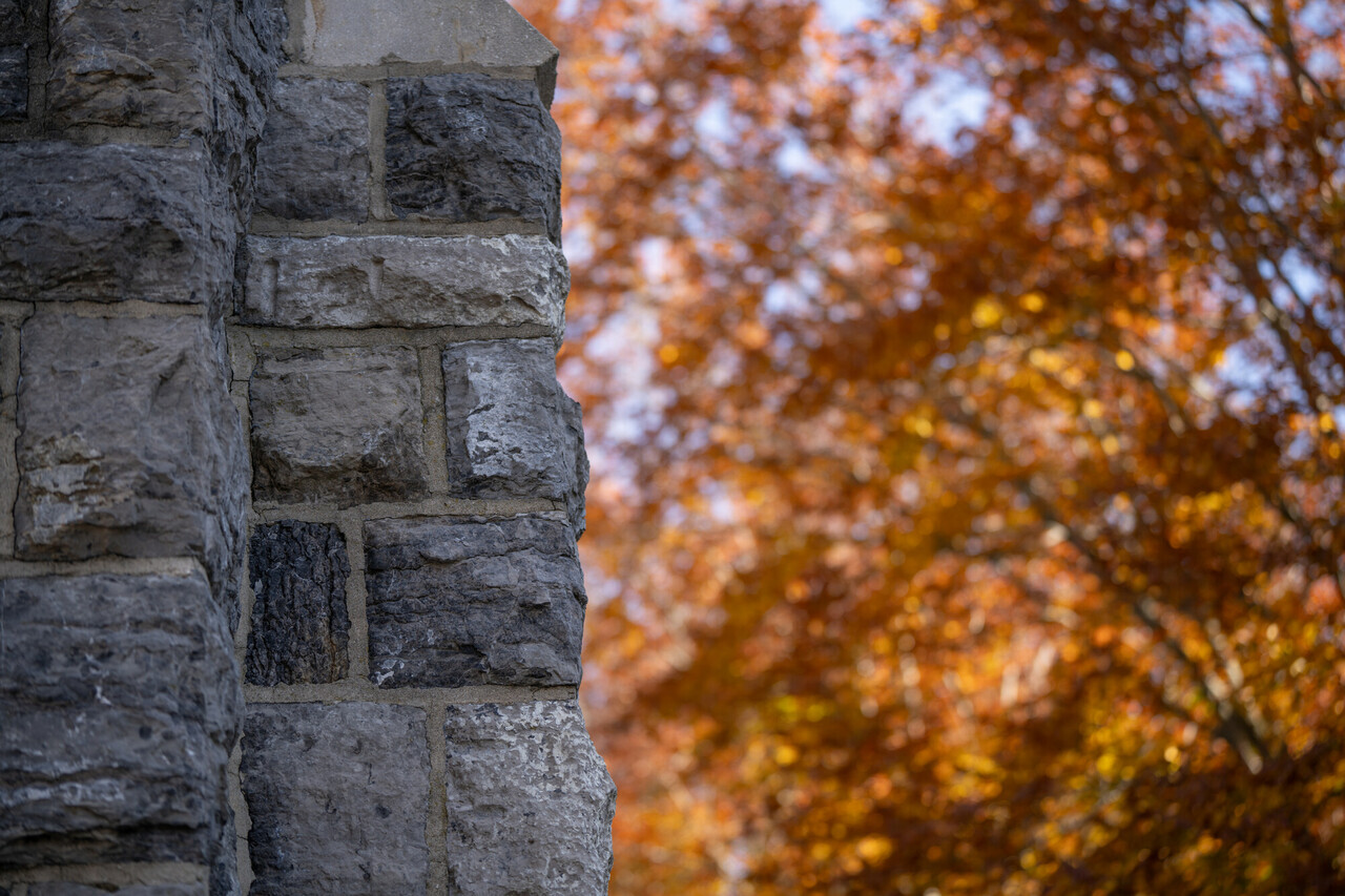 Hokie stone with a fall foliage background