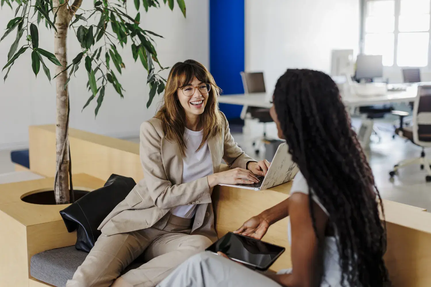 Equinix employees working together in a collaborative office setting