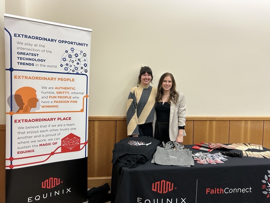 Photo of Weslie and her team in front of Equinix Booth at Career Fair