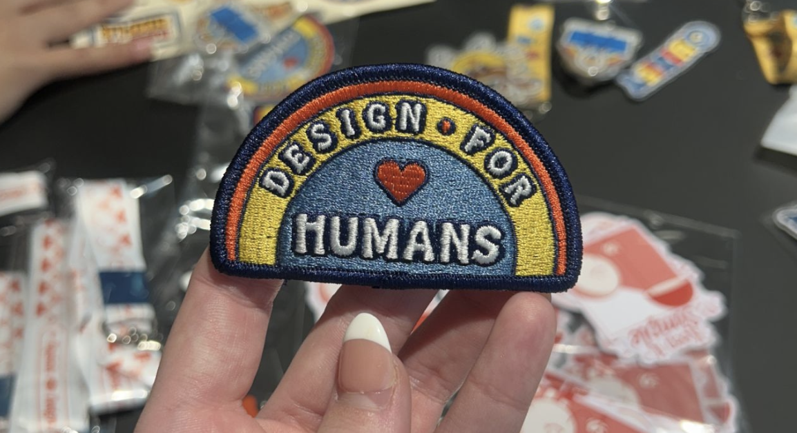 A rainbow patch that says "Design for Humans."