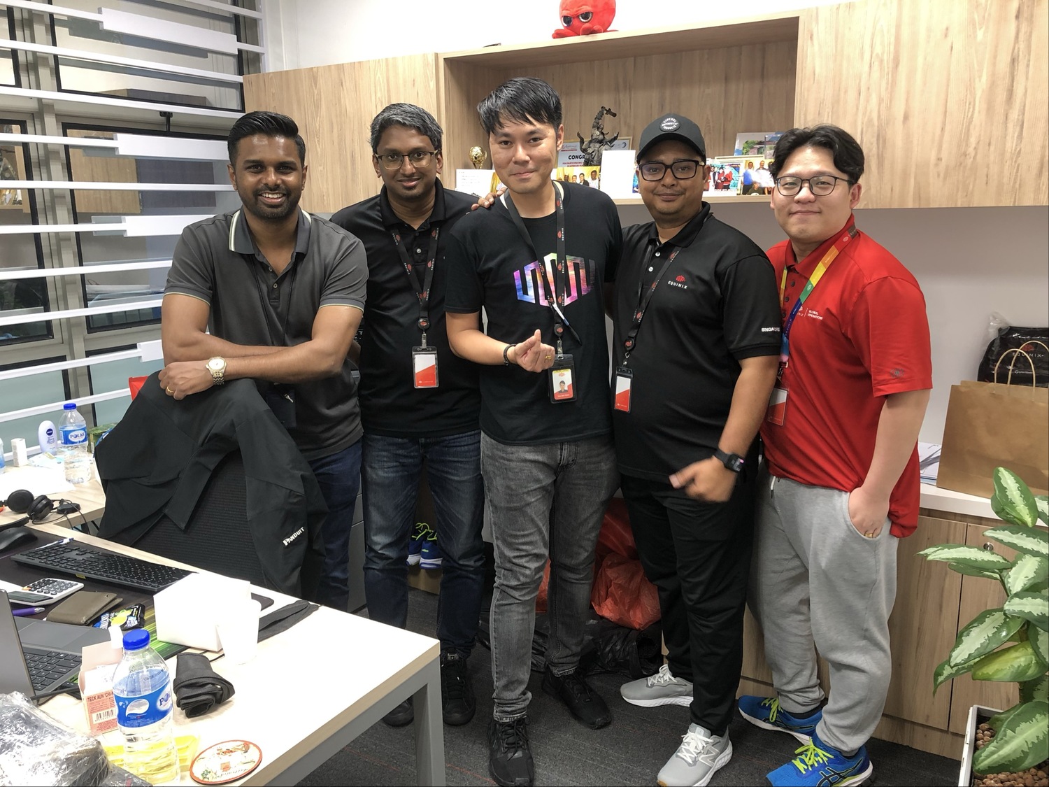 Yan (middle) with his team in Singapore