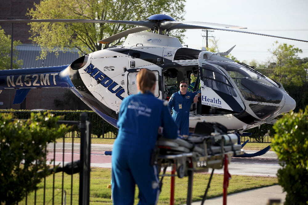 Aircraft, Helicopter, Vehicle, Adult, Male, Man, Person, Stretcher, Machine, Wheel