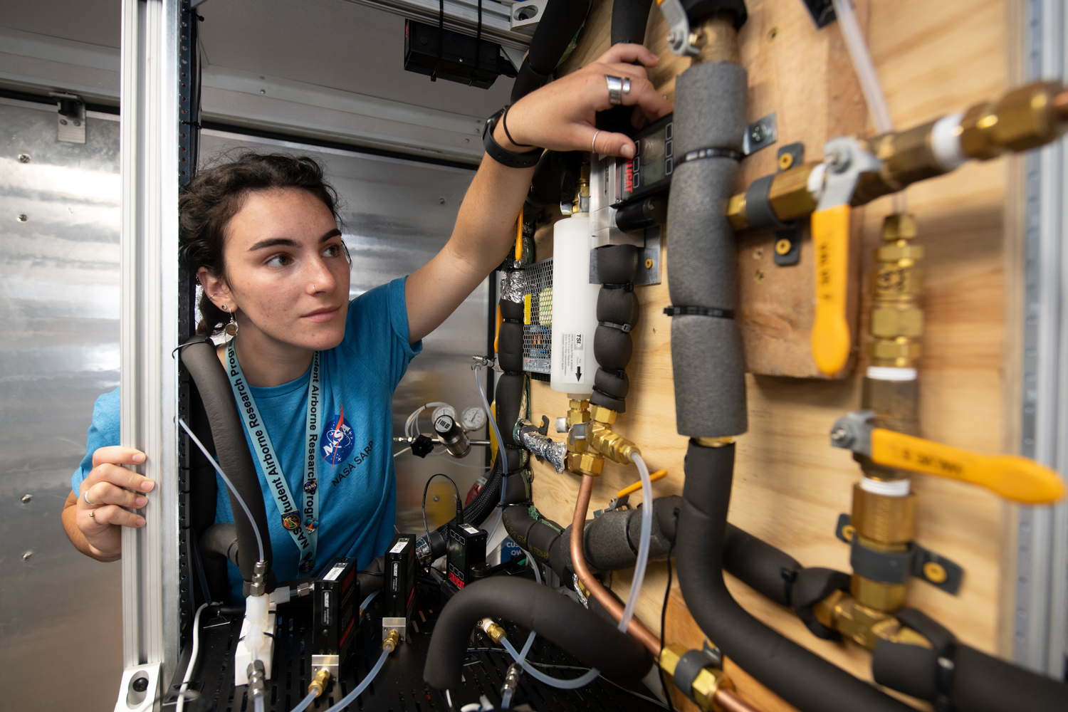 Person, Plumbing, Face, Head, E-scooter, Transportation, Vehicle, Architecture, Building, Factory