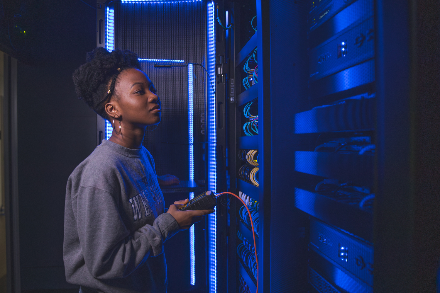 Picture of someone working on server equipment