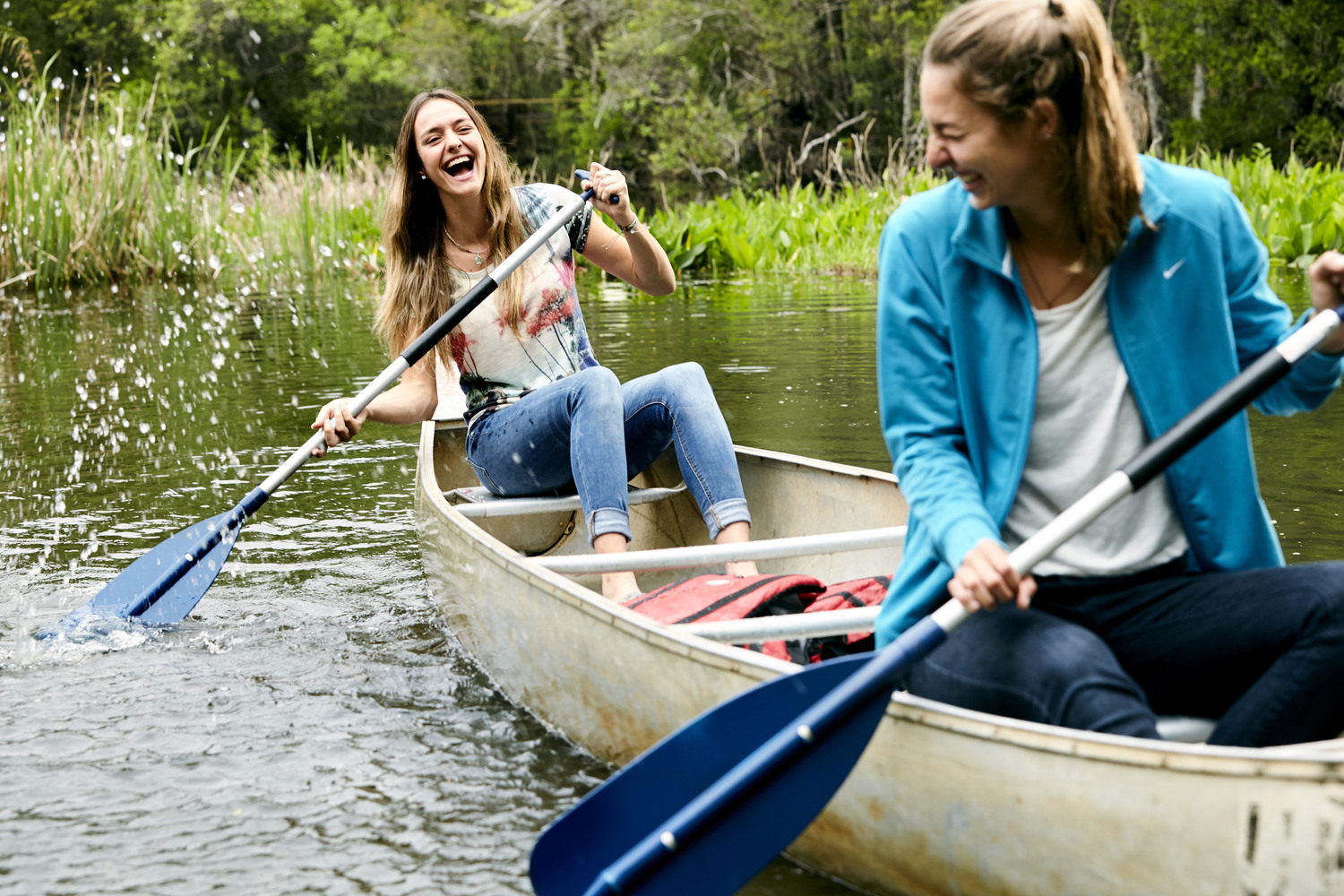 Picture of 2 students canoeing on campus area