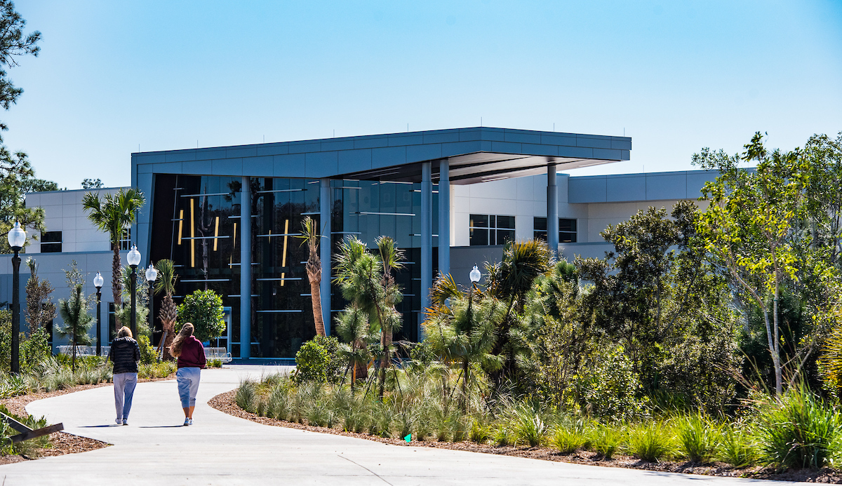 Building, Campus, Office Building, Person, Walking, City, Vegetation, Tree, Urban, Housing