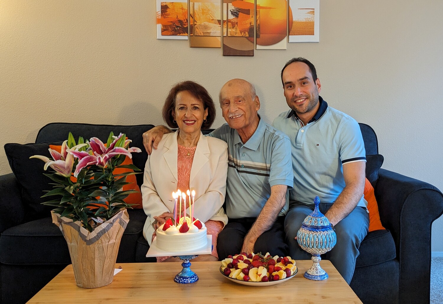 People, Couch, Table, Living Room, Flower Arrangement, Dining Room, Dining Table, Flower Bouquet, Birthday Cake, Icing