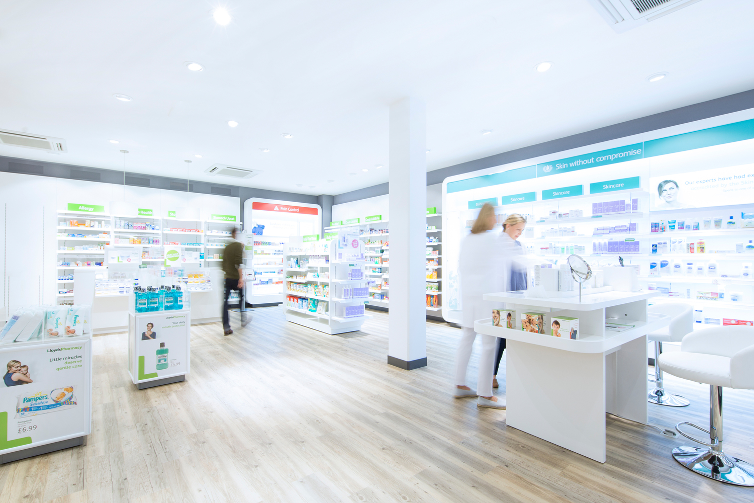 Pharmacy, Shop, Indoors, Interior Design, Room, Chair, Furniture, Person