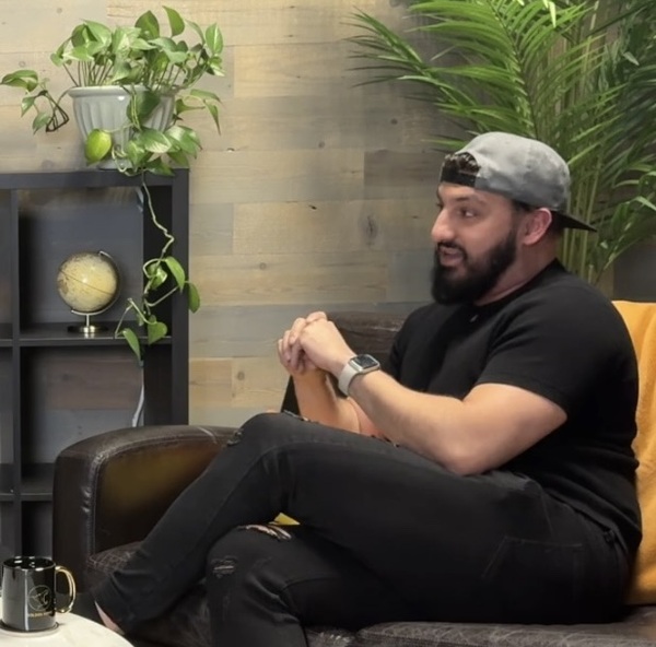 Person, Sitting, Potted Plant, Interior Design, Face, Head, Adult, Male, Man, Baseball Cap